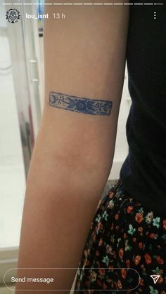 a person with a tattoo on their arm