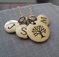 a fun way to keep your family or friends initials. three small initial discs hang playfully on a fine 14k gold filled chain along with tree of life charm. all bronze charm with 14k gold filled chain 16''with 2''extender. initial charm-8mm in diameter tree charm-12mm in diameter Grandma Mothers Day Gift, Necklace Family, Grandmas Mothers Day Gifts, Gift For Grandmother, Mommy Necklace, Gift Tree, June Bug, Fortune Cookies, Christmas Gifts For Grandma