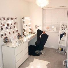 a person is sitting in front of a vanity