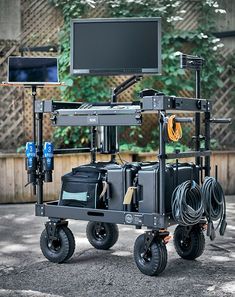 a computer monitor sitting on top of a cart