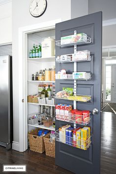 an open pantry door with food and drinks in it