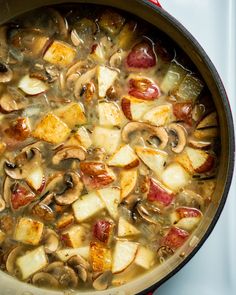 a pot filled with lots of food on top of a stove