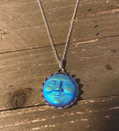 Mystical Blue Round Jewelry, Blue Mystical Moon Charm Jewelry, Blue Mystical Necklace With Moon Charm, Mystical Blue Moon Charm Jewelry, Blue Sun And Moon Pendant Necklace, Mystical Blue Moon Phase Necklace, Blue Mystical Moonstone Necklaces, Celestial Blue Moonstone Necklace, Mystical Blue Moonstone Necklaces