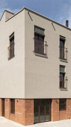 an apartment building with windows and balconies