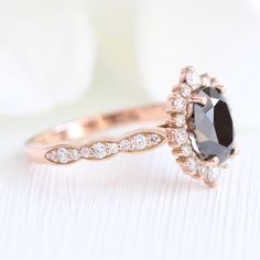 Black Diamond Engagement Ring Rose Gold Cluster Halo Diamond Oval Ring | La More Design Elegant Black Diamond Wedding Ring, Wedding Black Diamond Ring, Black Oval Diamond Wedding Ring, Wedding Diamond Ring With Black Diamonds, Oval Black Diamond Wedding Ring, Black Wedding Dress With Rose Cut Diamonds, Black Diamond Ring With Rose Cut For Wedding, Black Rose Cut Diamond Wedding Ring, Wedding Black Rose Cut Diamond Ring