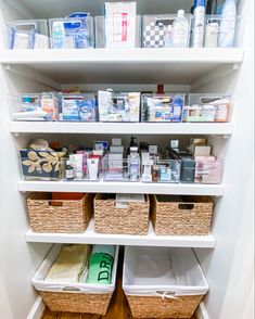 an organized pantry with baskets and toiletries