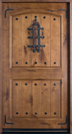 a wooden door with metal handles on the front and side panels, in an architectural style