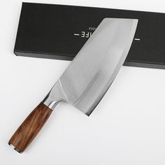 a large knife sitting on top of a black box