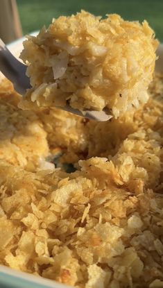 a close up of food in a bowl with a spoon sticking out of the top