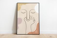 a painting on the wall with a woman's face and hands touching her nose