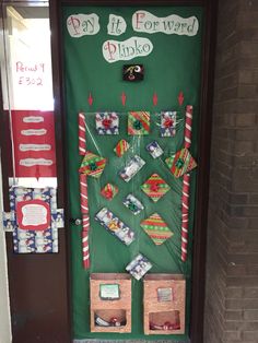 a door decorated with candy canes and christmas decorations