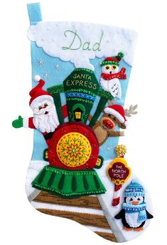 a christmas stocking with an image of santa and other animals on it's side