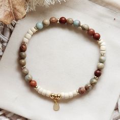 Need a super cute gift for your bestfriend or maybe just to spoil yourself. This enchanting boho style bracelet has an 18k gold plated  charm as its central focal point. Delicately suspended amongst the natural jasper stone and coconut shell beads this gold charm adds a touch of sophistication and refinement. -6mm Aqua Jasper Stone Beads -4mm Coconut Essential Oil Diffuser Beads -18k Gold Plated Beads and Charm -Beautifully Packaged to be Gift Ready -Free Jewellery Pouch  B R A C E L E T * S I Z Gifts For Your Bestfriend, Coconut Essential Oil, Boho Style Bracelets, Jewellery Pouch, Natural Aromatherapy, Beaded Jewellery, Craft Markets, Jewellery Ideas, Coconut Shell