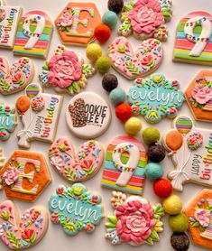 decorated cookies are arranged in the shape of letters and numbers