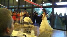 the bride and groom are dancing at their wedding reception