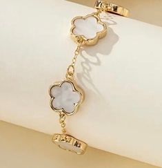 Elegant white clover leaf design, perfect for daily wear or special occasions.  High quality material for durability and shine. Elegant White Bracelets With Flower Charm, White Clover, Clover Bracelet, Fredericksburg Va, Clover Leaf, Chain Link Bracelet, Leaf Design, Link Bracelets, Chain Link