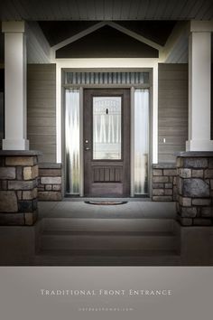 the front entrance to a house with stone steps