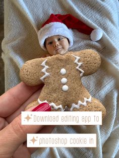 a hand holding a gingerbread cookie with a santa hat on it's head