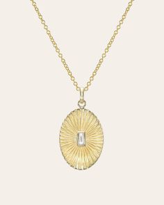 Beautifully handcrafted pleated oval with diamond baguette bezel center, 14k solid gold, chic and timeless, hanging from a cable link chain. Wear it by itself or layered, day or night. Made in L.A. Diamond Carat Weight: Approx. 0.10ctw Diamond clarity: VS Size: Approx. 19mm (H) 14mm (W) Ships in 5 to 12 business days Rush orders ship in 3 to 6 business days Comes gift ready in a custom Zoe Lev jewelry box. *Eligible for return, per our policy. See here for details. Baguette Diamond Necklace, Gold Chic, Diamond Baguette, Gold Bead Bracelets, Hand Chain, Diamond Carat, Gold Hands, Bezel Diamond, Diamond Fashion