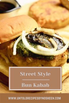 the bun kabab has onions on it and is ready to be served with some dipping sauce