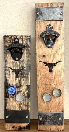 two pieces of wood with metal handles and knobs