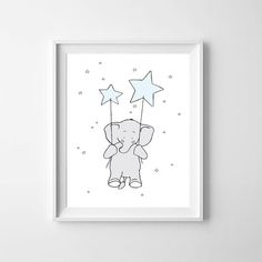 an elephant with stars on it's head is shown in a white framed frame