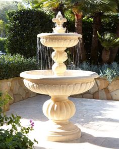 a white fountain sitting in the middle of a garden with text overlay that reads, beautiful fountains for the garden