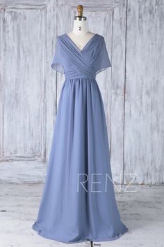 a blue bridesmaid dress on a mannequin dummy