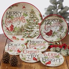 christmas plates and pine cones on a wooden table