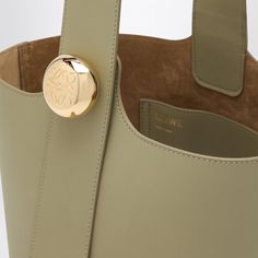 Here’s a bag that whispers elegance without being too loud about it. Its eucalyptus green hue feels like a fresh breeze on a sunny day, and the buttery soft calfskin leather is just the kind of luxury that feels right at home. Perfect for those who appreciate a good blend of style and practicality. Magnetic closure for easy access Adjustable shoulder strap with gold-tone button featuring engraved anagram logo Internal flat pocket to keep your essentials organized Gold-tone metal hardware for a t Eucalyptus Green, Medium Bag, Louis Vuitton Shoulder Bag, Green Colour, Medium Bags, Metal Hardware, Green Bag, Bag Women, Gold Tone Metal