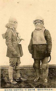 an old photo of two children dressed up in costumes with masks on their heads and feet