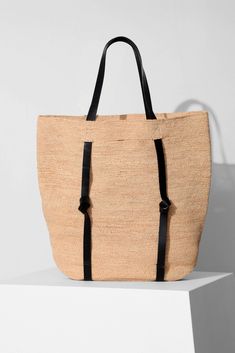 Tanner is a large straw tote that features our signature hat-holding feature. | VACANCES by Janessa Leoné Raffia Palm, Crochet Shoulder Bags, Janessa Leone, Summer Tote, Straw Handbags, Weekender Tote Bag, Straw Tote, Weekender Tote, Shopping Tote Bag