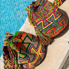 100% Authentic Wayuu Bag Handcrafted By Indigenous Tribe In Colombia. Each Bag Is Unique Art Work That Follows Hundred Years Of Traditions And Believes Of The Tribe. Bag Are Approximately 9 To 13 Inches In Diameter And Depth The Strap Measure Between 32 And 40 Inches. One Of A Kind New Without Tags. Multicolor Handwoven Hobo Bag For Travel, Multicolor Bucket Bag For Travel, Multicolor Satchel Hobo Bag For Vacation, Multicolor Hobo Bag With Removable Pouch For Vacation, Multicolor Bucket Bag With Removable Pouch For Beach, Multicolor Woven Crossbody Bucket Bag, Multicolor Beach Bucket Bag With Removable Pouch, Multicolor Tote Bucket Bag For Festivals, Multicolor Hobo Bag With Braided Handles For Travel