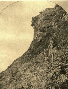 an old black and white photo of a mountain