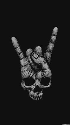 a skull with two fingers up in the air