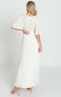 Sitting Pretty Dress In Natural | Showpo White V-neck Maxi Dress With Smocked Back, V-neck Maxi Dress With Smocked Back For Vacation, V-neck Maxi Dress With Button Closure For Daywear, White Flowy V-neck Maxi Dress, Summer Button-up Maxi Dress For Daywear, Button-up Maxi Dress For Summer Daywear, Modest Flowy Maxi Dress With Empire Waist, Flowy V-neck Maxi Dress With Buttons, Flowy Rayon Maxi Dress For Casual Occasions