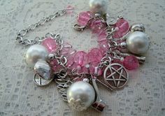 "This beautiful bracelet has pink faceted beads, pink Czech glass beads, pearl beads, pewter silver bead caps, silver foil beads, pewter silver pentacle and pewter silver charms. 7\" long can be adjusted to 8\". Lobster clasp." Pink Mystical Handmade Jewelry, Pink Handmade Mystical Jewelry, Handmade Mystical Pink Jewelry, Nickel-free Silver Witchy Jewelry, Pink Gothic Jewelry, Handmade Pink Gothic Jewelry, Spiritual Nickel-free Pink Jewelry, Jewelry Witchcraft, Witch Charm Bracelet