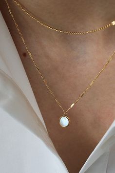 Thin and dainty layered necklace. This lightweight neck gem has a rounded pendant at the center. Reflected flat chain shimmers in the sunlight. Singular lobster clasp in the back makes for easy application and removal. Gold Charm Necklace, Layered Necklace, Layered Necklaces, Lobster Clasp, Charm Necklace, Gems, Chain, Pendant, Gold