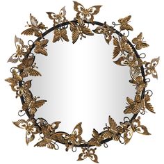 a mirror with gold butterflies on it and an ornate frame in the shape of a circle