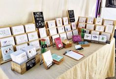 a table topped with lots of cards and pictures