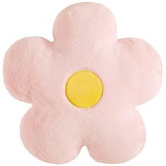 a pink flower shaped pillow with a yellow center