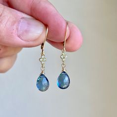 Blue Topaz Earrings, Dark Blue Teardrop Dangle Earrings, December Birthstone, Navy Drop Earrings Gold or Silver, Gemstone Gift for women  These precious delicate earrings feature dark blue topaz teardrops adorned with a white topaz connector in either gold filled or sterling silver. The earrings are suspended from lever back ear wires in the finish of your choice. These navy earrings are very feminine and a small pop of color for a blue loving girl. Ideal gift for a December birthday since this Blue Teardrop Fine Jewelry Earrings, Blue Teardrop Crystal Earrings, Sapphire Teardrop Gemstone Earrings, Sapphire Teardrop Crystal Earrings, Blue Teardrop Crystal Earrings With Ear Wire, Blue Gemstone Crystal Drop Earrings, Blue Briolette Earrings Fine Jewelry, Hypoallergenic Blue Briolette Earrings, Teardrop Blue Topaz Earrings