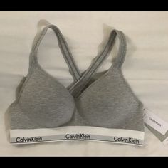 Grey Calvin Klein Sports Bra Sizexl Never Worn It Was Too Small Supportive Calvin Klein Activewear For Workout, Calvin Klein Sporty Activewear With Medium Support, Calvin Klein Medium Support Sports Bra For Workout, Calvin Klein Fitted Sports Bra For Athleisure, Calvin Klein Fitted Athleisure Sports Bra, Calvin Klein Fitted Sports Bra, Calvin Klein Sporty Activewear For Gym, Calvin Klein Sporty Fitted Sports Bra, Calvin Klein Casual Activewear For Gym