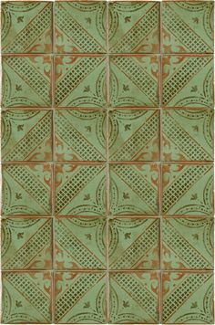 a green and red tile pattern with an intricate design on the bottom half of it