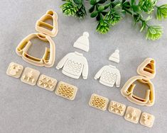 three cookie cutters and some cut outs on a table