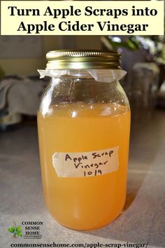 an apple cider vinegar in a glass jar with the words turn apple scraps into apple cider vinegar