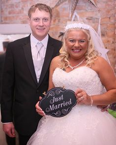 a bride and groom posing for a photo