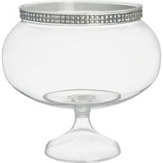 a clear glass bowl with silver trimmings on the rim and bottom, sitting on a white surface