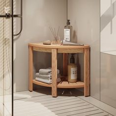 a bathroom with a wooden shelf next to a shower