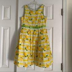 Girls Bloome Dress With Lemons Brand New With Tag Size 12 Summer Cotton Dresses With Lemon Print, Summer Cotton Dress With Lemon Print, Cotton Lemon Print Sundress, Cotton Sundress With Lemon Print, Yellow Cotton A-line Sundress, Casual Green Lemon Print Dress, Green Casual Dress With Lemon Print, Casual Green Dress With Lemon Print, Cute Yellow Spring Dress